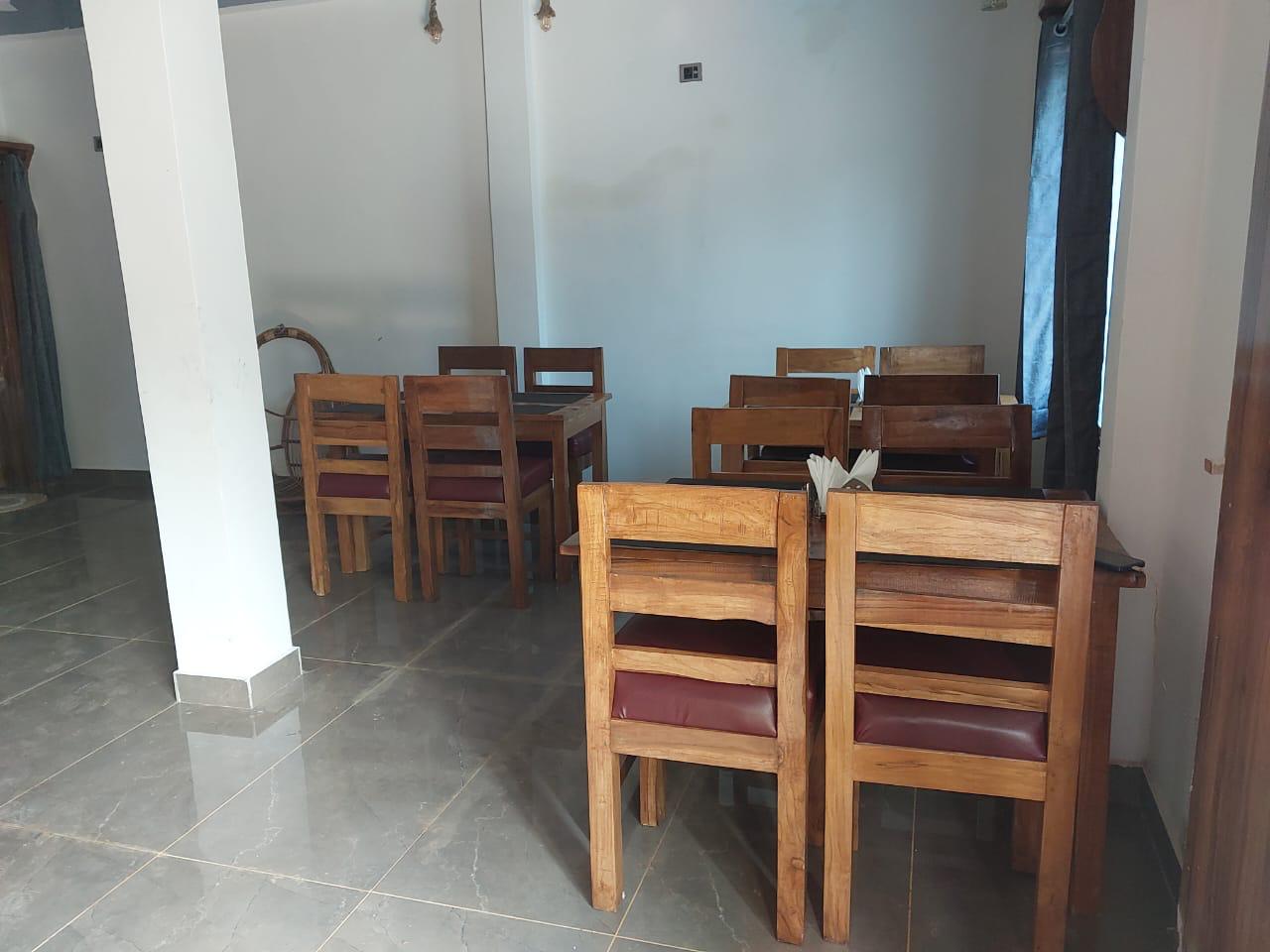 Luxury resort pool with palm trees at sunset